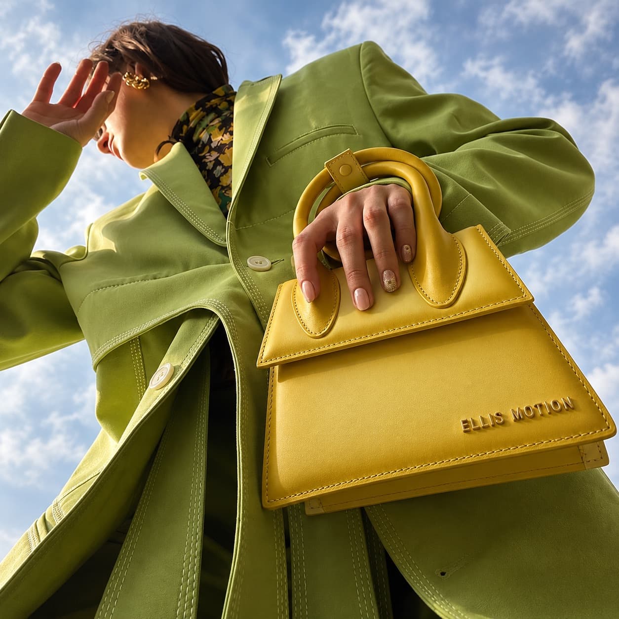 Premium leather handbag on a limestone plinth with gold hardware